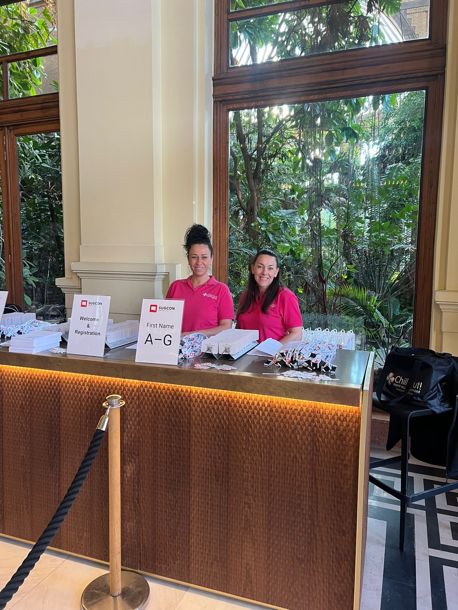 Two team members behind a table at event