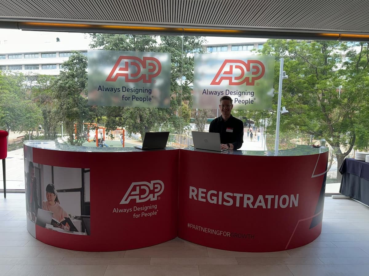 Team member behind ADP registration desk
