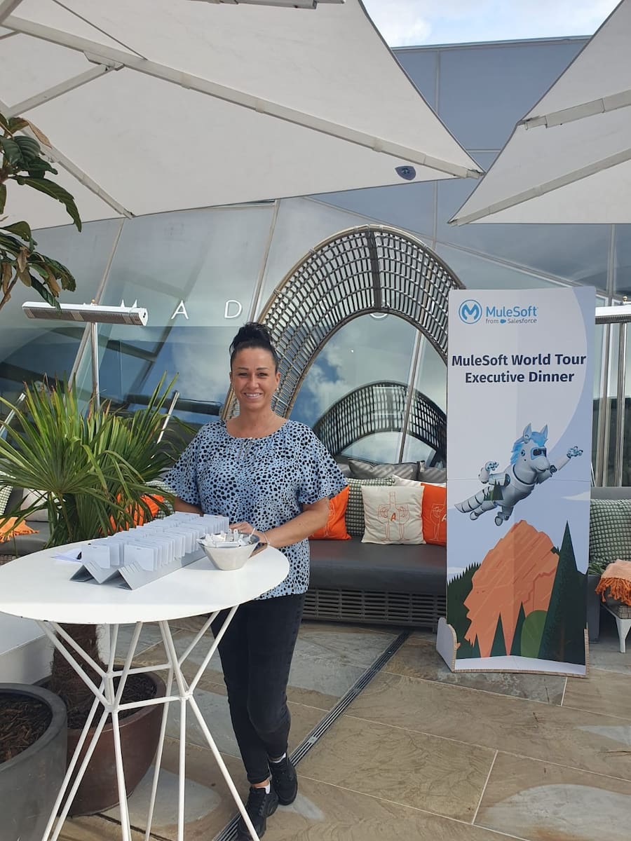 Team member at a table at event